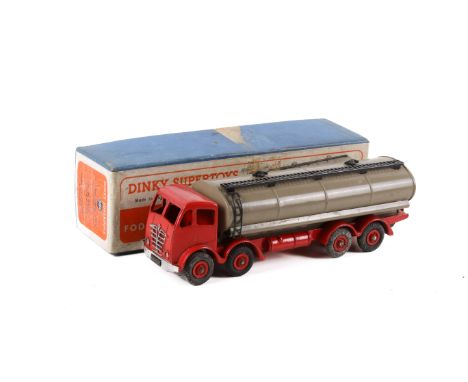 A Dinky Toys 504 'Foden 14-ton tanker'. Red cab, fawn tank with black ladders, red chassis and hubs, in the original box