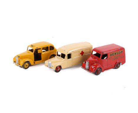 Three 1950s diecast commercial and emergency vehicles. Comprising a 31b Trojan 'Dunlop' van, red including rigid hubs, silver