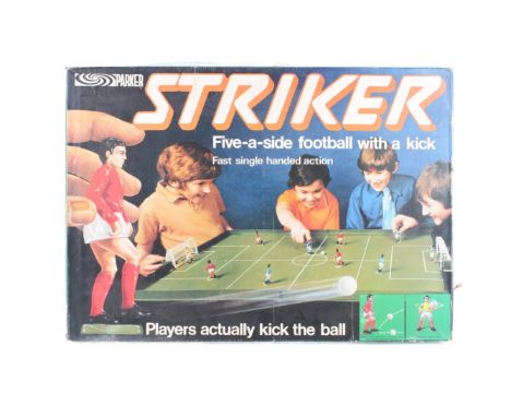 A Parker Games Striker football set. Complete, comprising eight players, two goalkeepers, a textured playing board, two goals