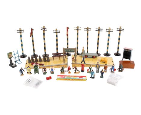 An assortment of Meccano Hornby OO gauge model railway station accessories. Including die cast figures (some repainted), post