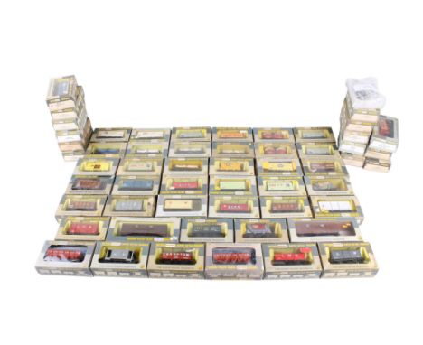 A large collection of boxed Wrenn 00 gauge wagons. Including W4655 16 Ton Mineral Wagon, W5019 Refrigerated Van, W5028 Banana