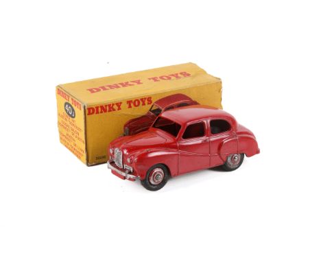 A Dinky 40j 'Austin Somerset Saloon'. Red body and ridged hubs with smooth tyres, silver trim, in the original box