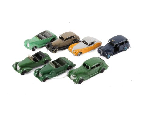 Seven 1950s Dinky diecast vehicles. Comprising a Chrysler in green, an Armstrong Siddeley Coupe in green, a Lagonda in green,