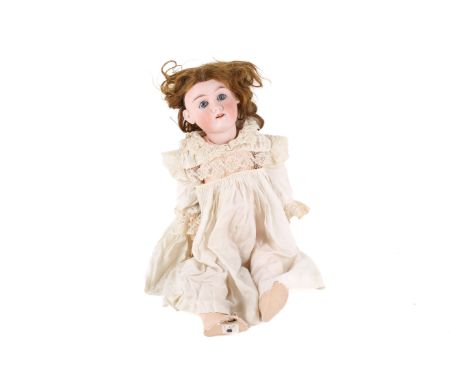 A Victorian Handwerck German bisque doll. Having blue sleeping eyes, open mouth, painted features and a brown wig, with a com