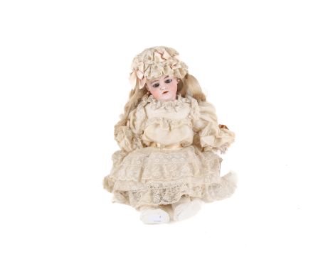 An early 20th century German DEP bisque headed doll. Having brown 'blinking eyes', open mouth, pierced ears,a blonde wig and 