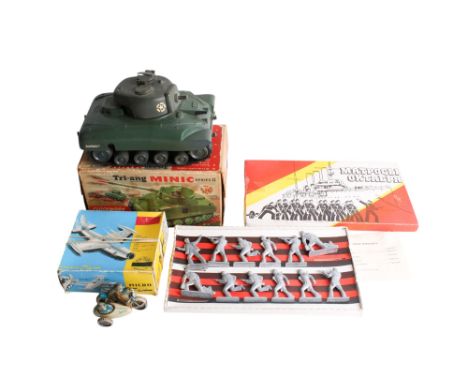 Four vintage toys. Comprising a boxed Tri-ang Minic Series II Sherman tank, a boxed Toy-Test Micro Jet, a German clockwork mo