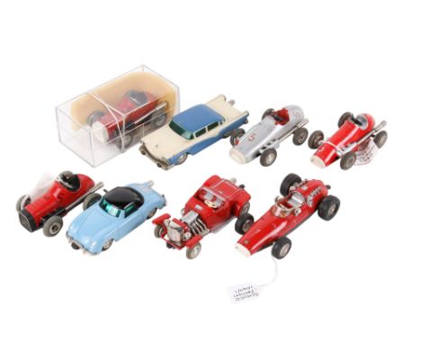 A collection of Schuco clockwork racing cars. Including 1040, 1041 (2) and 1043 Micro Racers, a 1040/1 Micro Racer Ferrari, 1