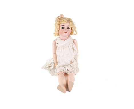 A Victorian Max Handwerck (Germany) porcelain headed doll. Having brown glass 'sleeping' eyes, open mouth and four teeth, pai