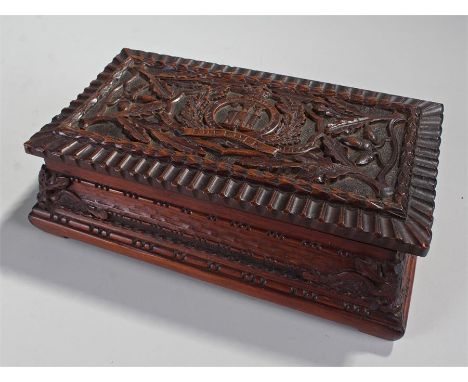 Suffolk Regiment, a carved cigar box, with the Suffolk crest and acorn branch surround, 28cm wide