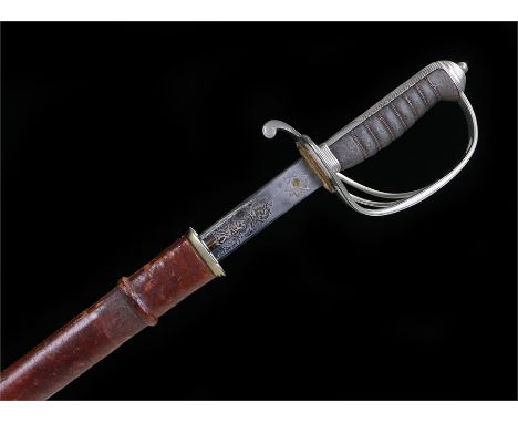 George V 1850 pattern Royal Artillery officers sword the etched blade with royal cipher and regiment crest, in its brown leat