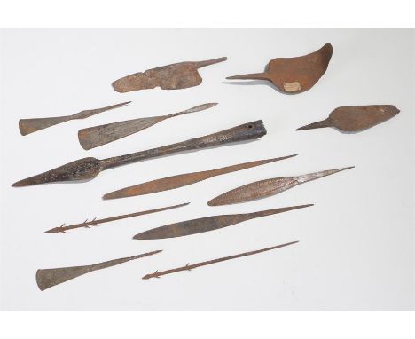 Twelve early 20th century African iron spear HEADS, arrow heads and a knife. Two spear heads with indistinct labels, the 8 ar