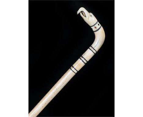 Fine George III whalebone walking stick, the carved eagle head with baleen bands above the tapering cane, 87cm long