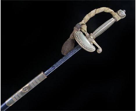 George VI court sword by Wilkinson Sword Co London, the etched blade with Kings crown cypher, in its leather scabbard