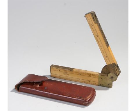 Folding rule, with a level, built in compass and rules, together with the leather case, the rule when folded 16.5cm long