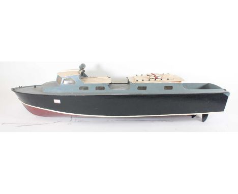 Aerokit wooden kit-built battery electric powered boat of RAF Crash Tender painted in red and black with a grey wooden deck, 