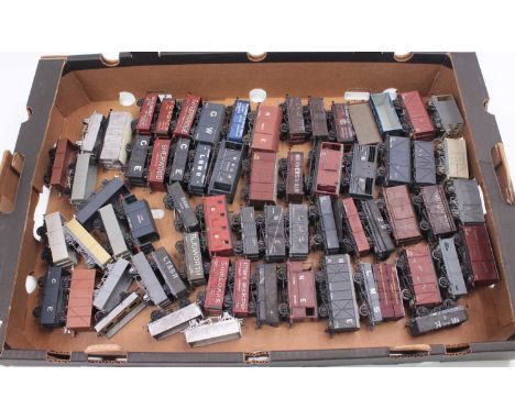 One tray containing approx 60 00-gauge kit built plastic and white metal wagons to include a cattle wagon, a Midland four-whe