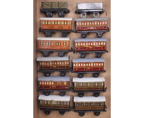 A box containing Bing Tabletop 00 gauge coaches, to include five LMS, three GWR, two LNER and two wagons. All are unboxed, an