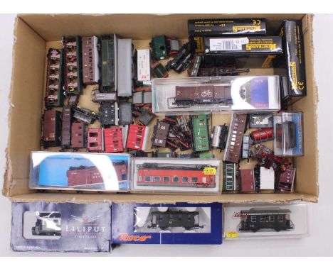 One tray containing various 009 gauge hand-built and commercially made wagons and coaches, including a Liliput continental fo