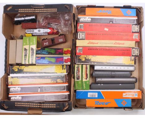 Two trays of HO gauge rolling stock to include a Jouef sealed SNCF coach, a Roco DB 1st/2nd composite coach, an ADE DB 2nd cl