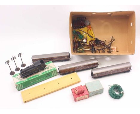 A small collection of Hornby Dublo to include an EDL7 3 rail LMS 0-6-2 tank, a 1575 lighting kit, two boxes of plastic buffer