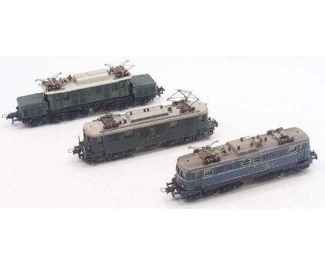 Three Trix Twin 00 gauge locos to include an E94, in green, main body is not attached to the chassis, with two pantographs, i