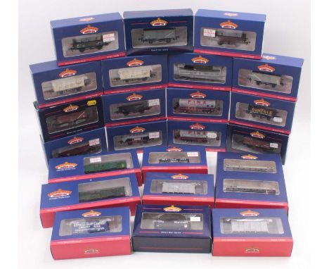 Twenty-four Bachmann 00 gauge wagons, to include petrol tankers, grain hopper wagons, mineral wagons, coke wagons, and others