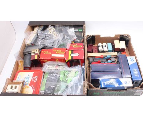 Two trays containing various 00 gauge rolling stock spares, accessories and buildings to include Dapol private owner wagons, 
