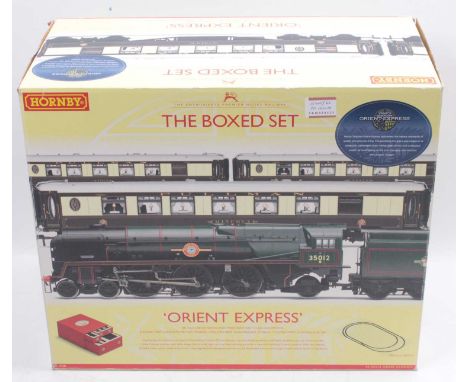 An incomplete Hornby 00 gauge boxed set ‘Orient Express.’ R1038. The loco should be Merchant Navy class ‘United States Lines.