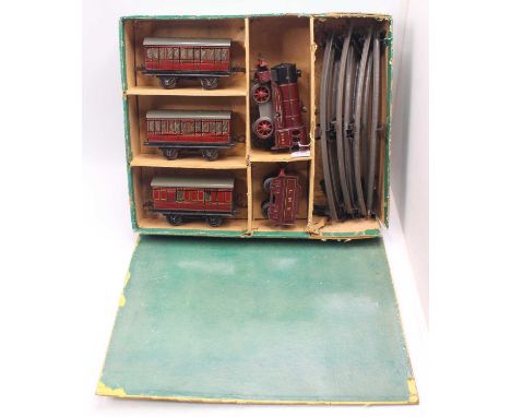 Late 1930’s Hornby 0-gauge clockwork train set comprising 1939/41 No.0 LMS 0-4-0 loco &amp; tender No.5600, rods detached, on