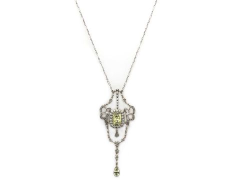 An Edwardian silver and paste necklace,the centrepiece composed of a cushion cut green paste, claw set to cut down collet, wi