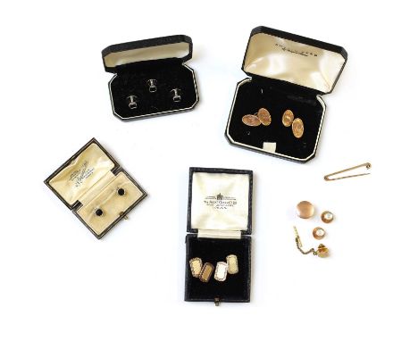 A small collection of gentlemen's jewellery,to include a pair of double-sided gold cufflinks, machine engraved with enamel me