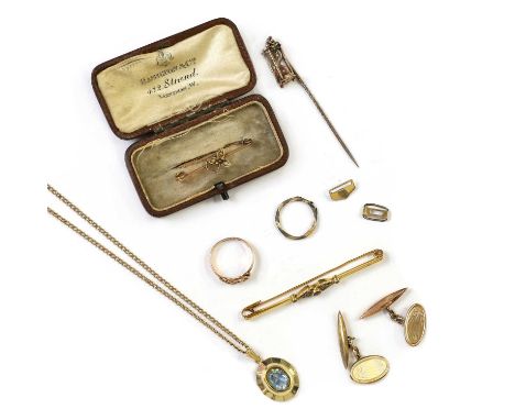 A small collection of gold jewellery,to include a Victorian egg timer stick pin, tested as 9ct, a late Victorian 9ct gold kno