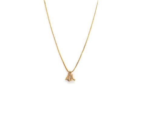 A pair of gold pendants modelled as roller skates,suspended from a foxtail link chain with bolt ring clasp. Pendants tested a