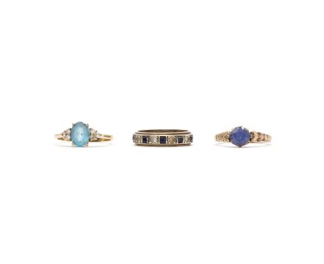 Three gold rings,to include a 9ct gold topaz and diamond ring, with an oval mixed cut topaz claw set to plain collet, with a 