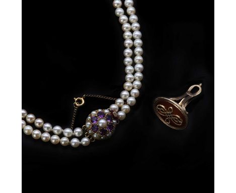 A double row graduated cultured pearl necklace,two rows of graduated round cultured pearls, strung plain to a 9ct bombé clust