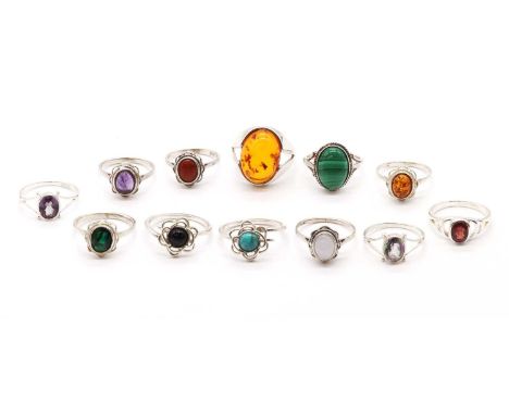 Twelve silver rings, to include a malachite cabochon ring, a 'mystic' coated topaz ring, a turquoise ring, two amethyst rings