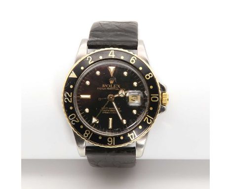 A gentlemen's bi-colour Rolex 'GMT-Master' automatic strap watch, c.1979,39mm diameter, with a black dial, baton hour makers,