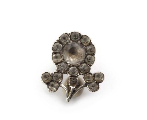 A Georgian silver rock crystal quartz flower brooch,the centre flower head composed of a faceted quartz bead set to cut down 