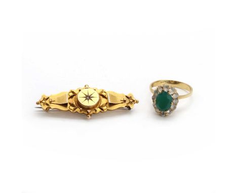 A 9ct gold memorial brooch,a rose cut diamond star set to the centre of a circular shield, to a scalloped edge bar with appli