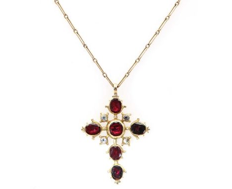 A late 18th century flat cut garnet and black dot quartz cross,suspended on an Edwardian fetter chain. The cross composed of 