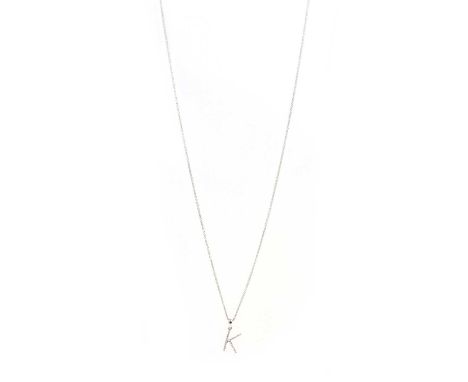A 9ct white gold diamond initial pendant 'K',with eight cut diamonds all bead set to the K shape frame, suspended on an adjus