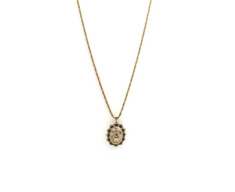 A 9ct gold sapphire pendant,The oval openwork piece with round mixed cut sapphires claw set to scroll collets, to a fixed bal