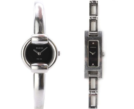 Two ladies' Gucci quartz bracelet watches,one with a round case, 25mm diameter, with a plain black dial and baton hands, to a