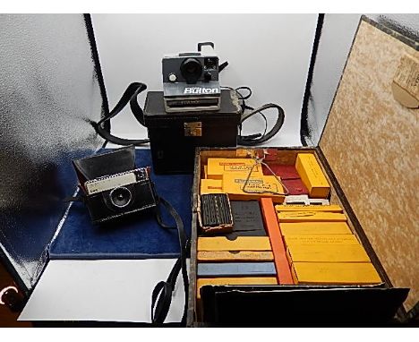 The Button polaroid land camera. Kodak instamatic 133 in case, box of films, slides etc