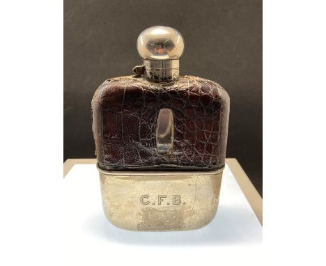 A silver and leather bound hip flask with bayonet silver fitting, hallmarks and makers stamps , height 15cm. Condition: inscr