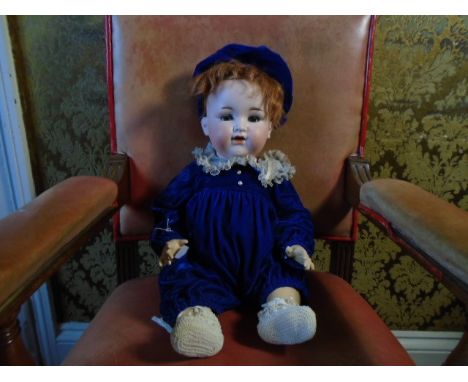 A vintage composite Armand Marseille doll with bisque face marked ' 990  - 13' articulated limbs and head with blue sleeper e