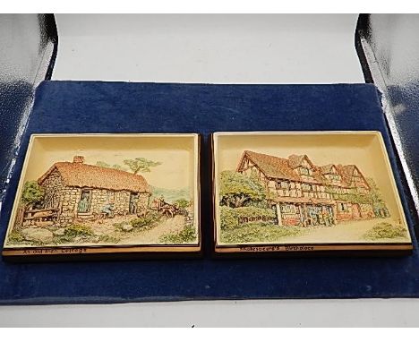 2 ceramic plaques depicting cottages by Bossons