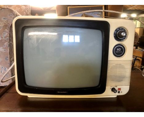 Vintage sharp portable TV ( sold as collectors/ display item)