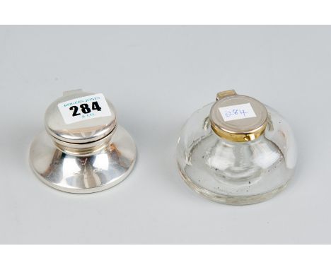 A circular plain silver inkwell with glass liner, Birmingham 1988 and a glass inkwell with white metal hinged lid