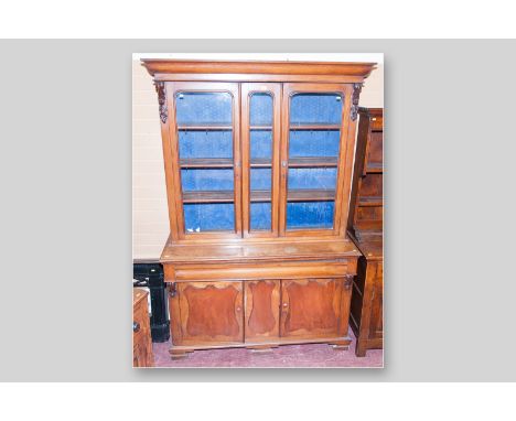 A Victorian oak and mahogany 2.5 door bookcase sideboard, a shaped top over twin arch glazed doors and matching half centre p